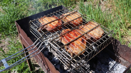 Pork steaks cooked on a charcoal grill outdoors