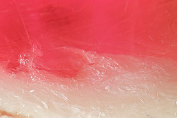 Fototapeta premium Beautiful abstract texture: multi-colored handmade soap in natural light macro shot. Background for postcards or text design.