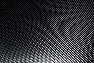 Structural detail of an industrial carbon fibre sheet in a full frame view.