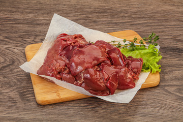 Raw chicken liver over board