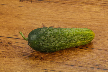 Green ripe fresh cucumber over background