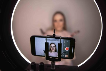  Beauty blogger recording makeup tutorial video at home