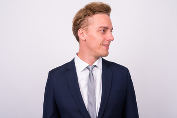 Young handsome Scandinavian businessman against white background