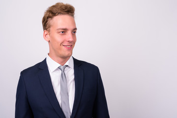 Young handsome Scandinavian businessman against white background