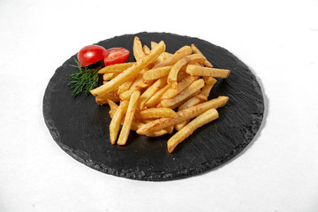 roasted potatoes on the blackboard. on white background