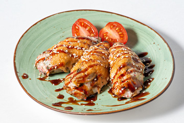 chicken breast in a plate on a white background
