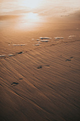 Footprints in the wet sand