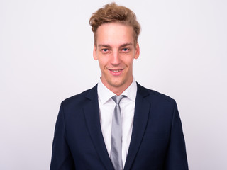 Young handsome Scandinavian businessman against white background