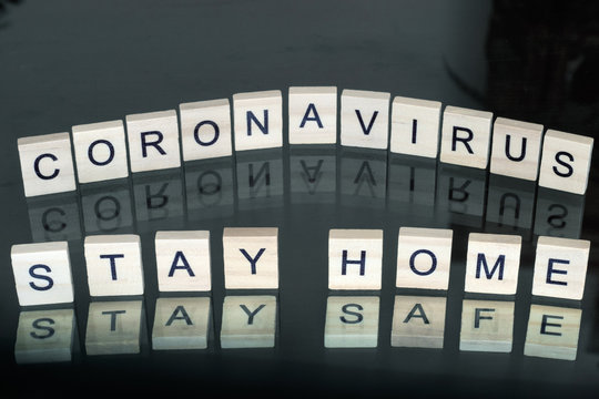 Stay home stay safe sign made from wooden block letters. Quarantine against coronavirus covid-19 in the world with a call to stay at home cozy. Coronavirus outbreak and lockdown concept. - Powered by Adobe