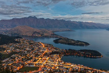 New Zealand, Otago, Queenstown, Town on shore of Lake?Wakatipu?at dusk with mountains in background