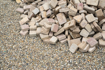 concrete paving repair, disassembled path folded by a pile of stones