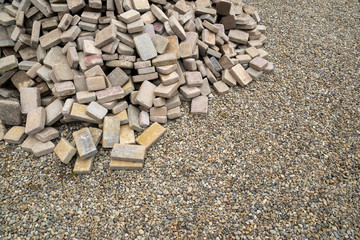 disassembled stone pavers piled in a heap