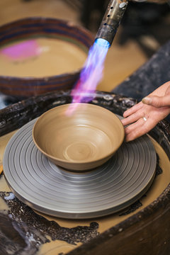Close-up of potter working on workpiece