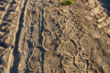 traces of shoes on a dirt road, close up