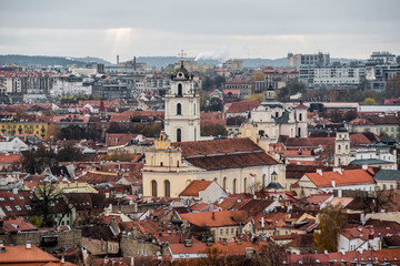 Fototapeta na wymiar panoramic view of old town vilnius with church and orange roofs