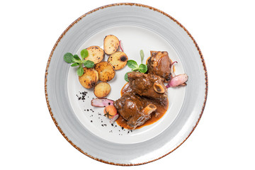 stewed beef bone on a plate on a white background