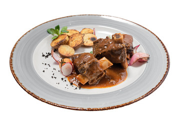 stewed beef bone on a plate on a white background