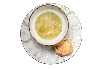 broth with a pie on a white background