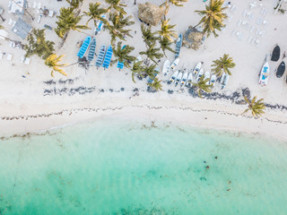 aerial view of crystal clear blue water in the caribbean beach with boats