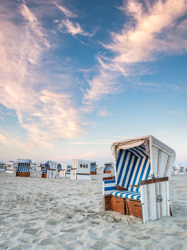 Summer vacation in a beach chair at the North Sea coast near Sankt Peter-Ording, Schleswig-Holstein, Germany