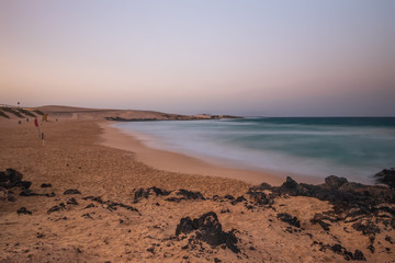 Long exposure view of Playa del Dormidero Beach or Playa El Viejo, located at Grandes Playas Corralejo - Fuerteventura, Canary Islands, Spain. October 2019