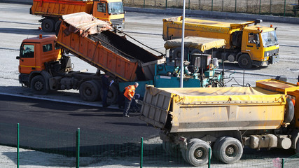 Road construction works with commercial equipment.