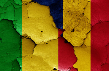 flags of Mali and Chad painted on cracked wall