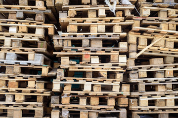 Lots of old wooden pallets for transportation.