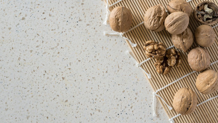 Top view walnuts on the kitchen table.
