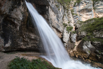 Fototapeta na wymiar Waterfall in the Dolomite Mountains