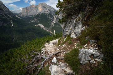 Rocky mountain slope covered with grass in the dolimites