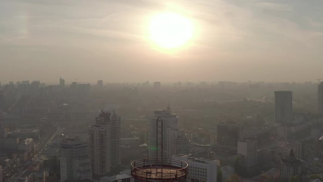 silhouette of a roof spire, lightning rod in a skyscraper. against the backdrop of sunset and evening city center
