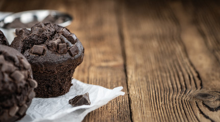 Chocolate Muffins (selective focus; detailed close-up shot)