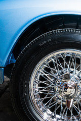 Close-up of a wheel on a classic blue Triumph Spitfire Mark III 1967