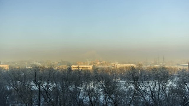 Timelapse of natural landscape and landscape with sunlit clouds, wide-angle panorama, with elements of an industrial landscape in the afternoon.