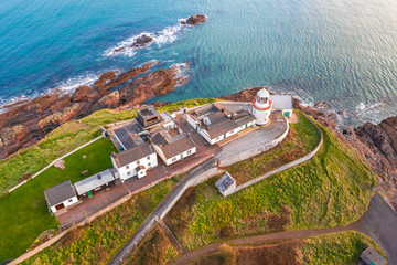 Amazing view aerial drone Irish Coastal Coastline Roches Point Lighthouse  - obrazy, fototapety, plakaty