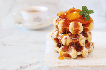 Belgian waffles with caramelized orange and honey for breakfast