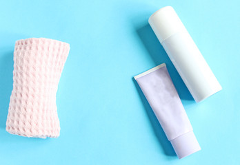 White bottle with Body antiperspirant deodorant roll-on on blue background.