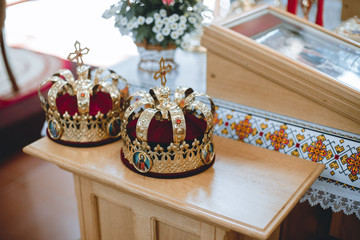 Orthodox wedding crowns, church icons, church books, gospel on the table