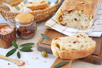 Mediterranean cuisine. Homemade sourdough bread with dried tomatoes and olives