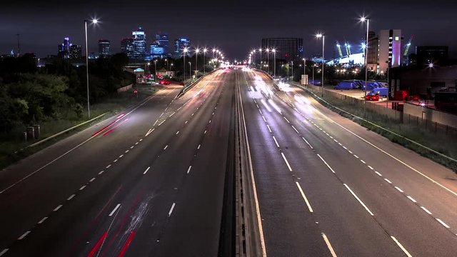time-lapse of fast road into city