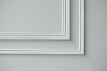 Decorative stucco in the classic interior of the house. The angle of the frame molding white for...