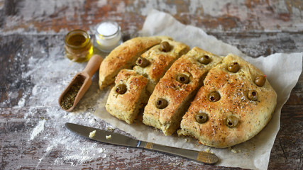 Delicious fragrant homemade focaccia. Traditional italian bread. Cooking at home.