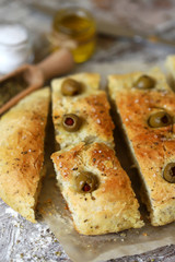 Delicious fragrant homemade focaccia. Traditional italian bread. Cooking at home.