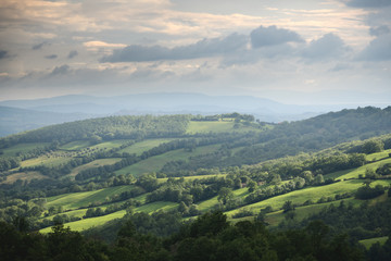 Naklejka premium landscape with mountains and clouds tuscany