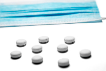 Medical background made of pills and virus mask. Horizontal frame