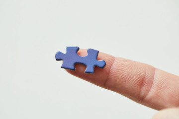 puzzle piece on finger