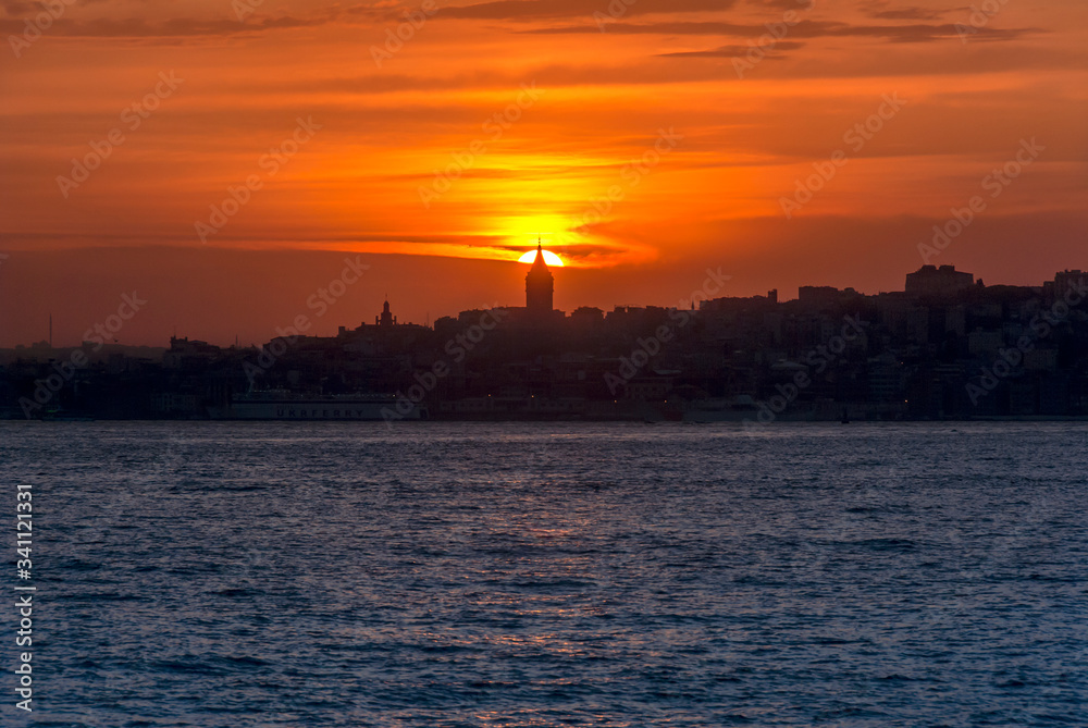 Poster Beyoglu, Istanbul, Turkey, 24 May 2007: Galata Tower, King of Byzantine Anastasius, 528, Sunset.