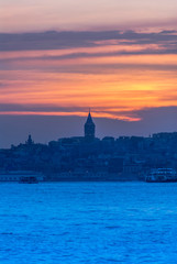 Beyoglu, Istanbul, Turkey, 24 May 2007: Galata Tower, City Lines Ferry, King of Byzantine Anastasius, 528, Sunset.