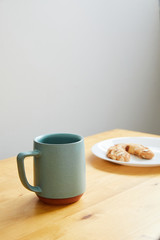 coffee cup with pastry on plate